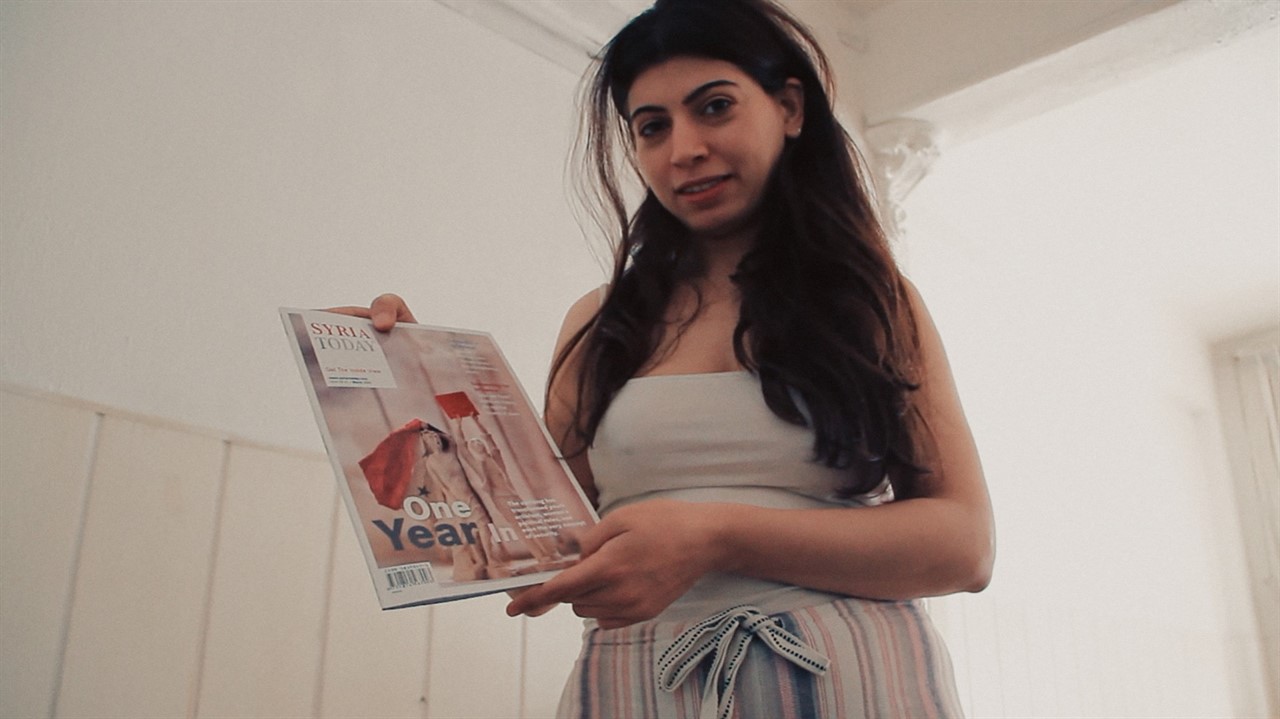 Woman holds a copy of 