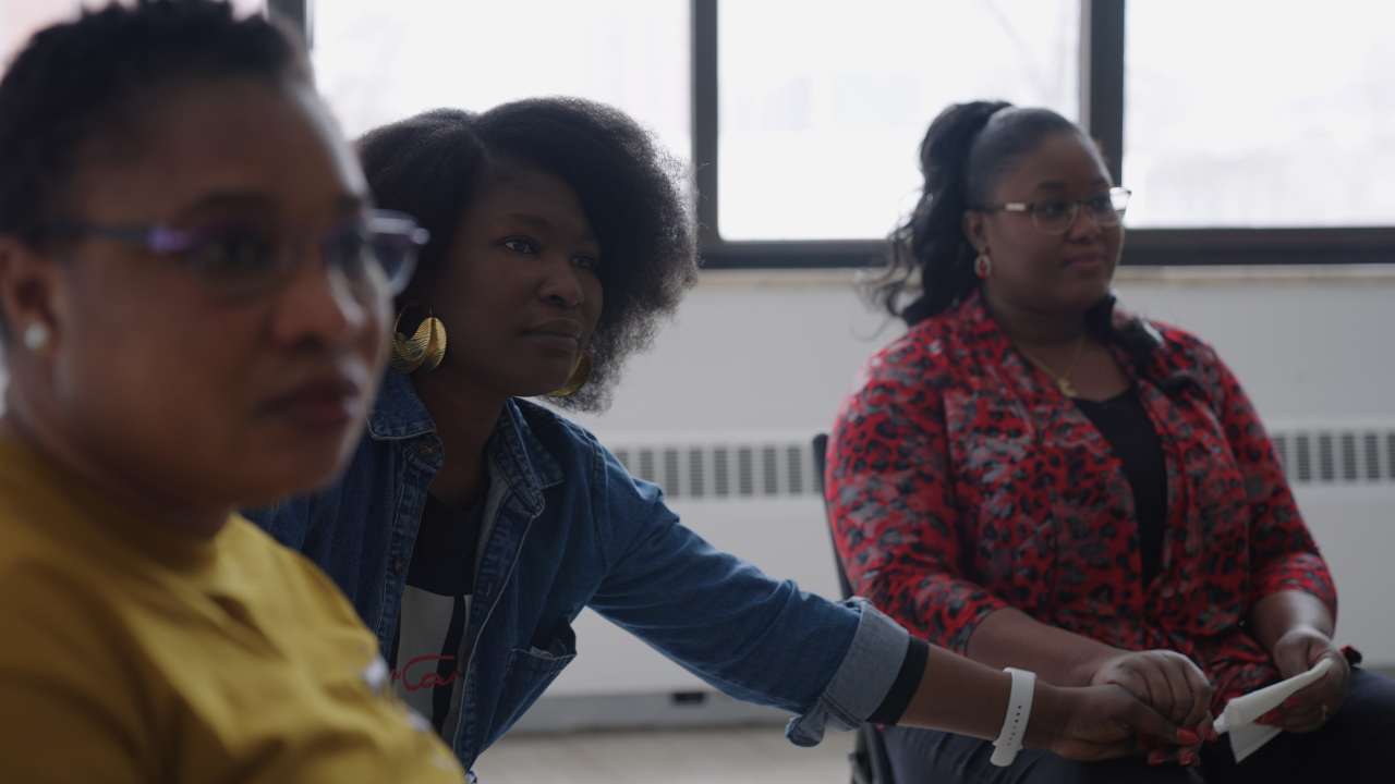 three women sitting together