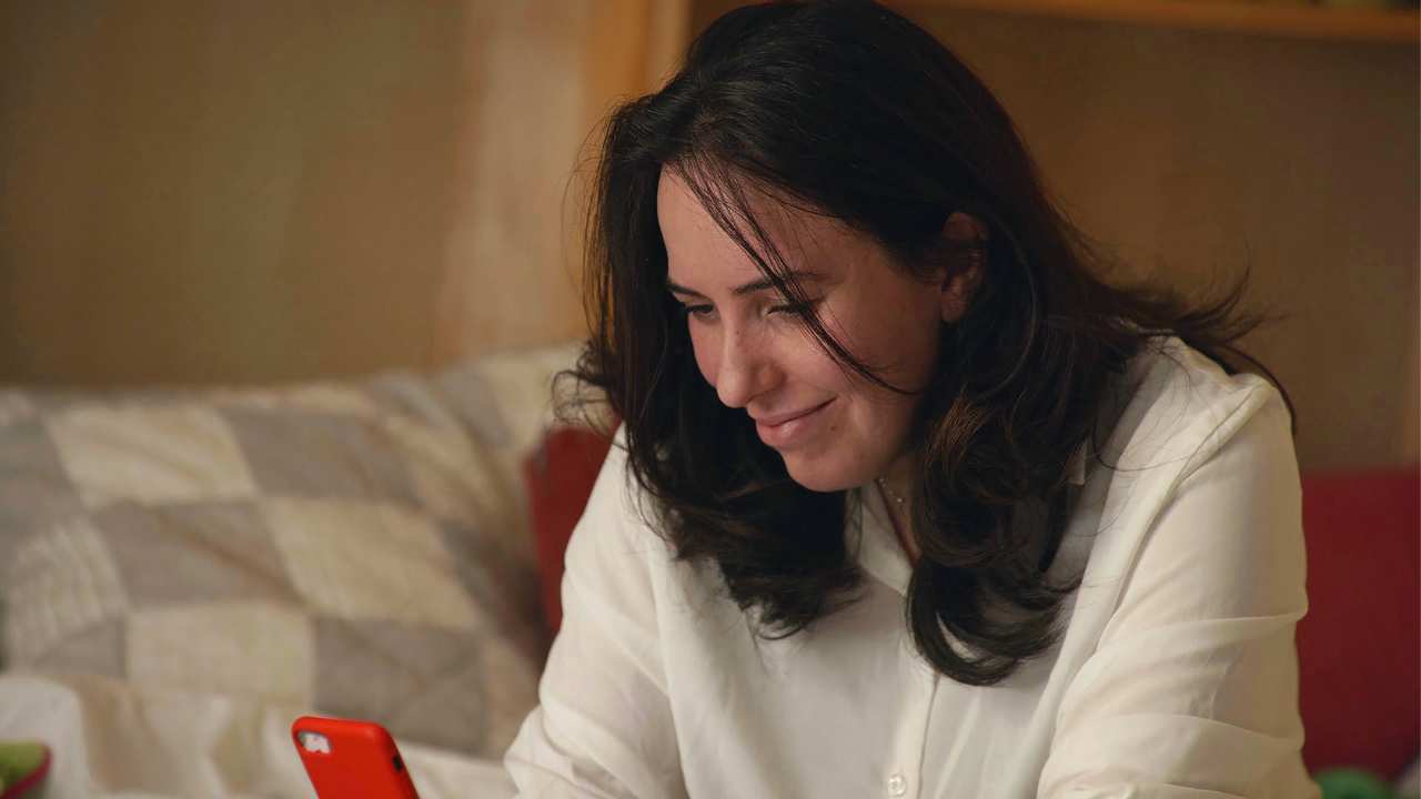 a woman looking at a phone