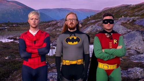 Three man in superhero costumes on a mountain