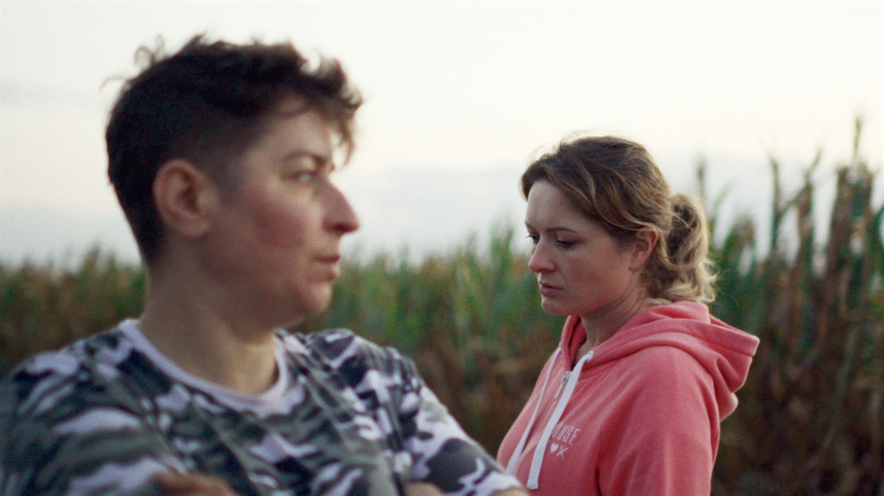 Two women, one with short hair; other a ponytail