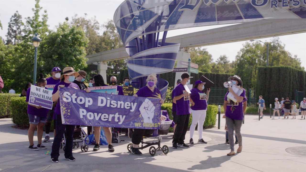 Crowd protesting Disney poverty