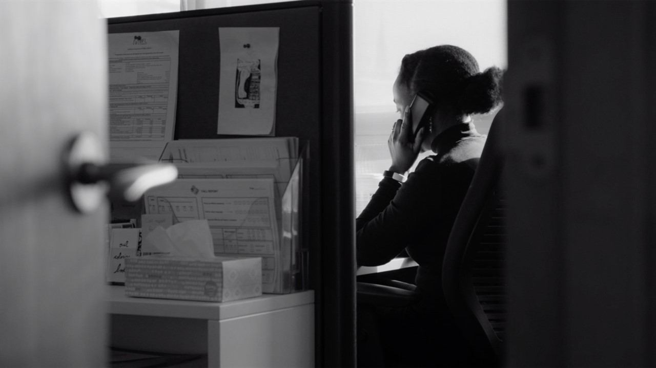 Woman on a phone in a cubicle