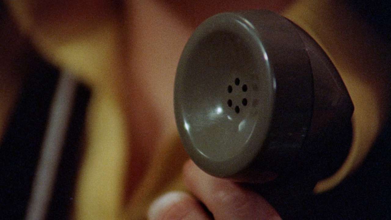 someone holding a phone receiver