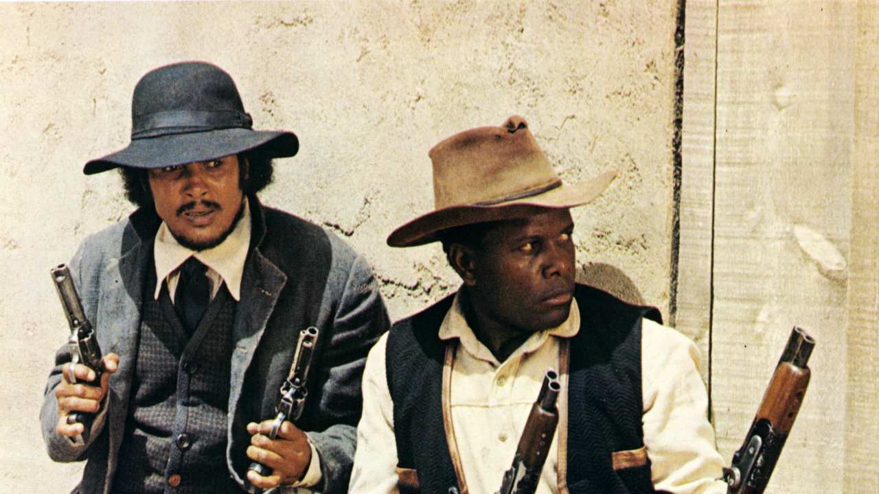 two men holding guns