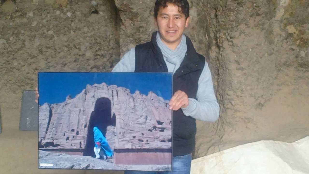 a man holding a photo