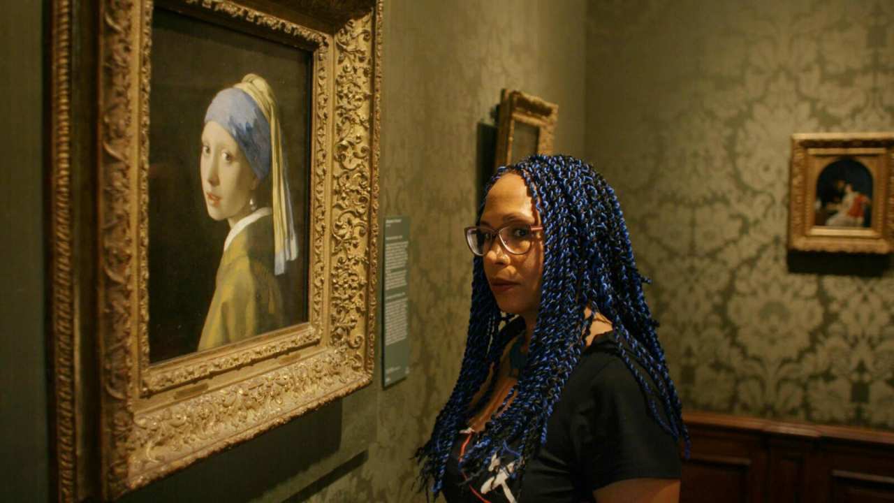 a woman and a painting