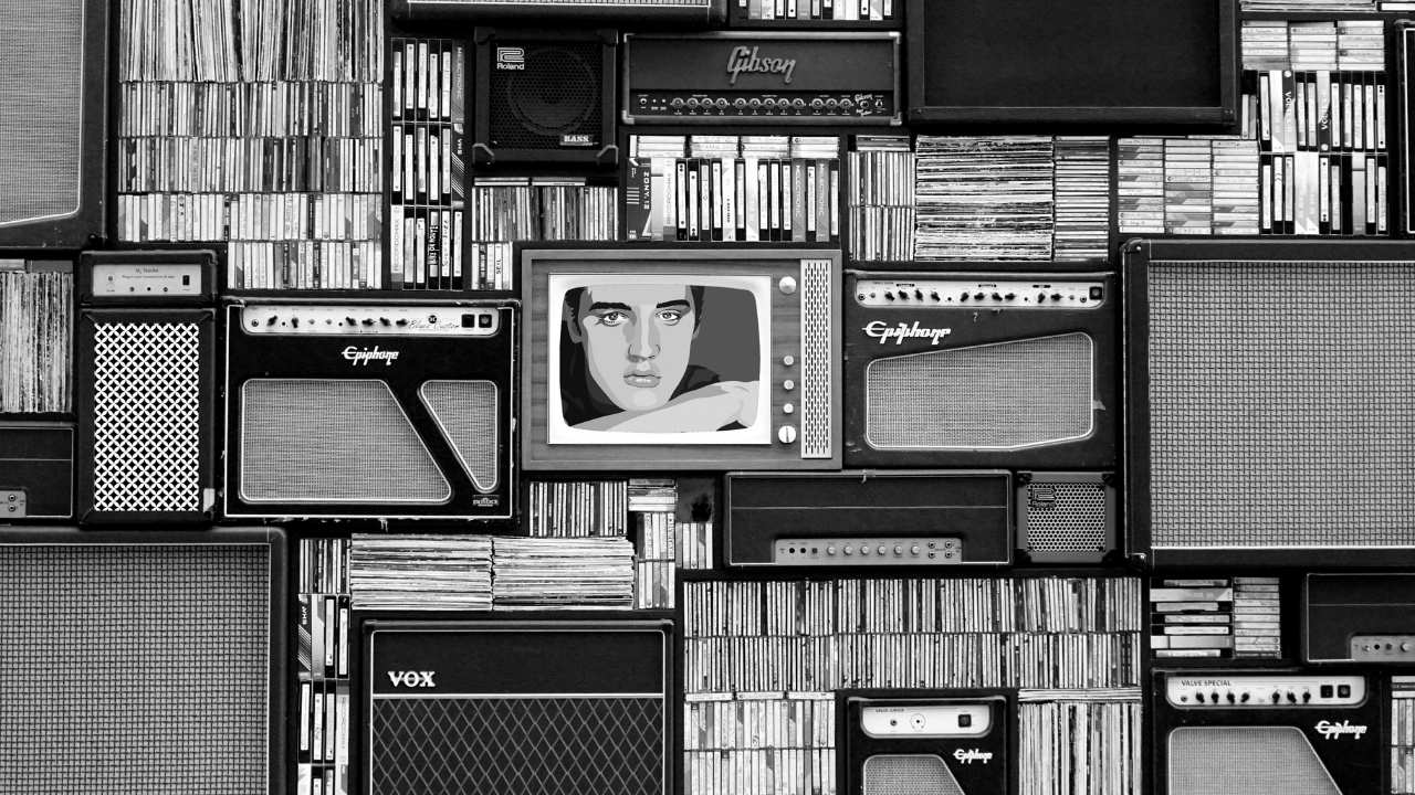 TV sets and radios in front of music collections