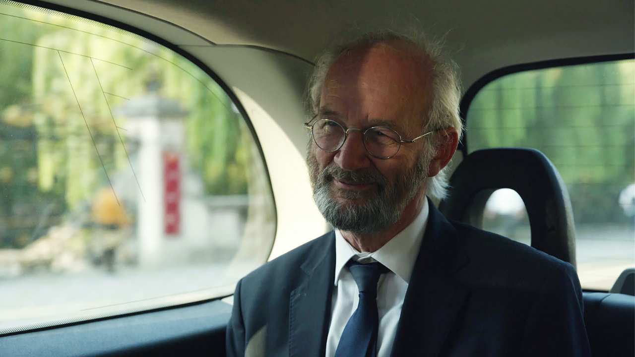 a man with a beard in a car