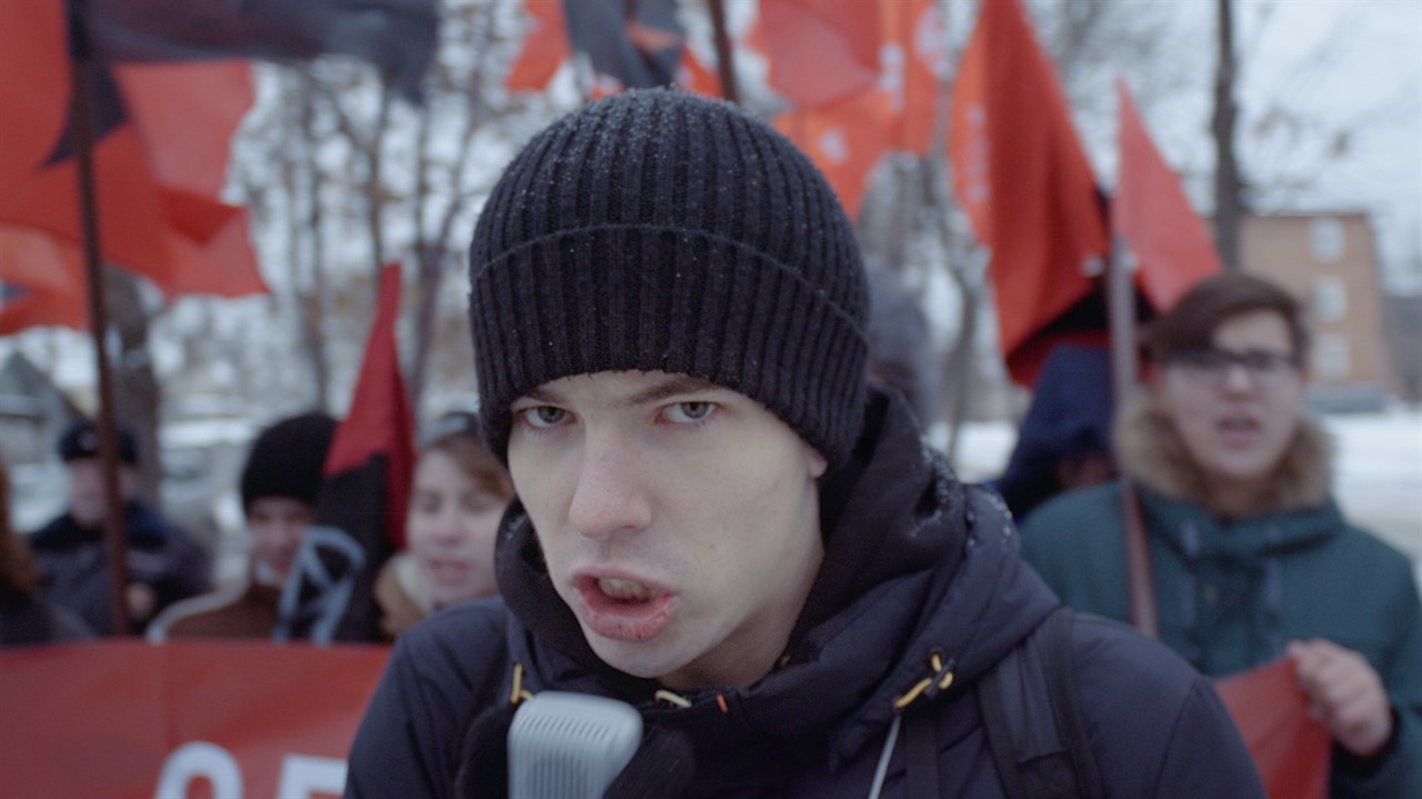 Closeup of a person in a touque looking agressive