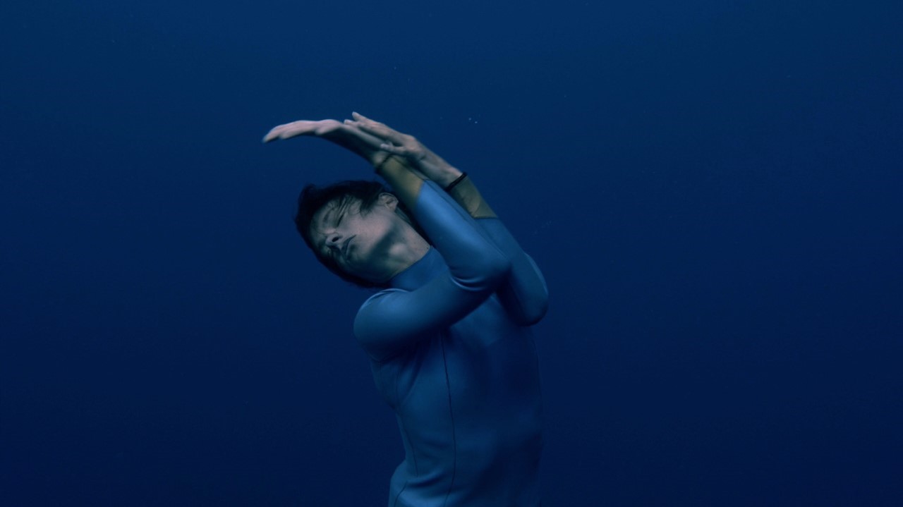Person dancing underwater