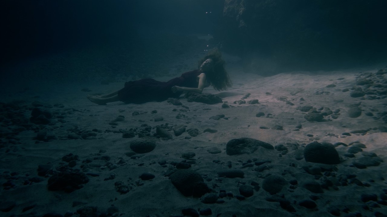 Woman on the bottom of the ocean