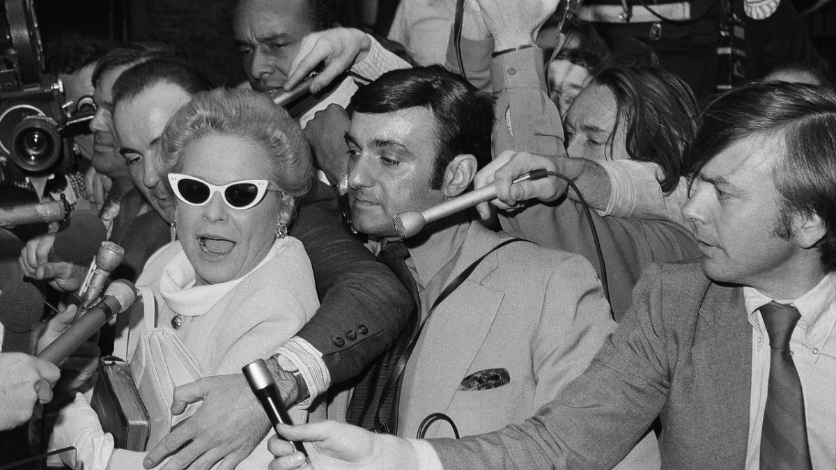 Martha Mitchell surrounded by press