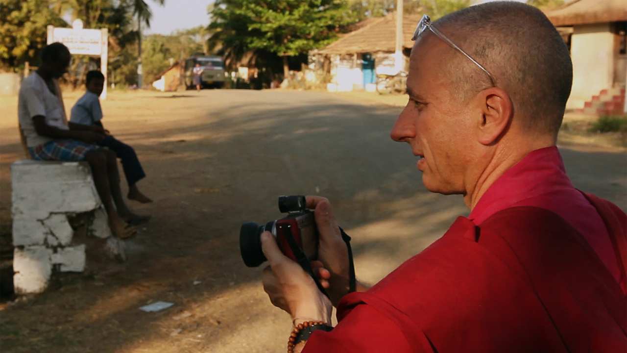 a man with a camera looking to the left