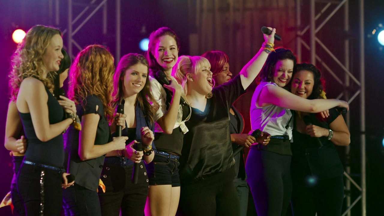 a group of women with microphones