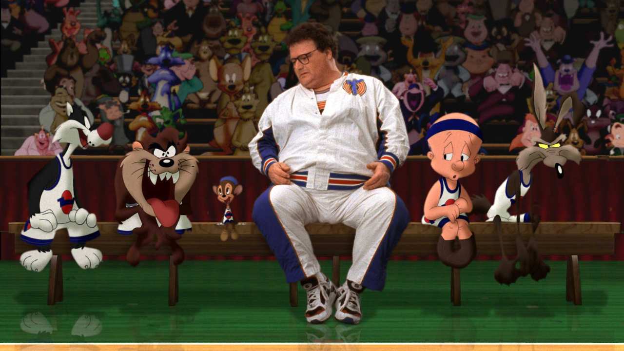 a man sitting on a bench with cartoons