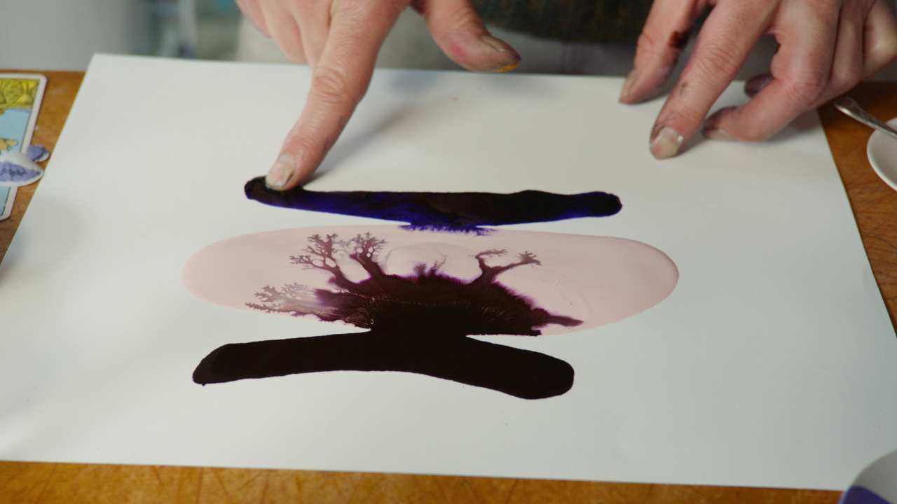 a person painting with their fingers