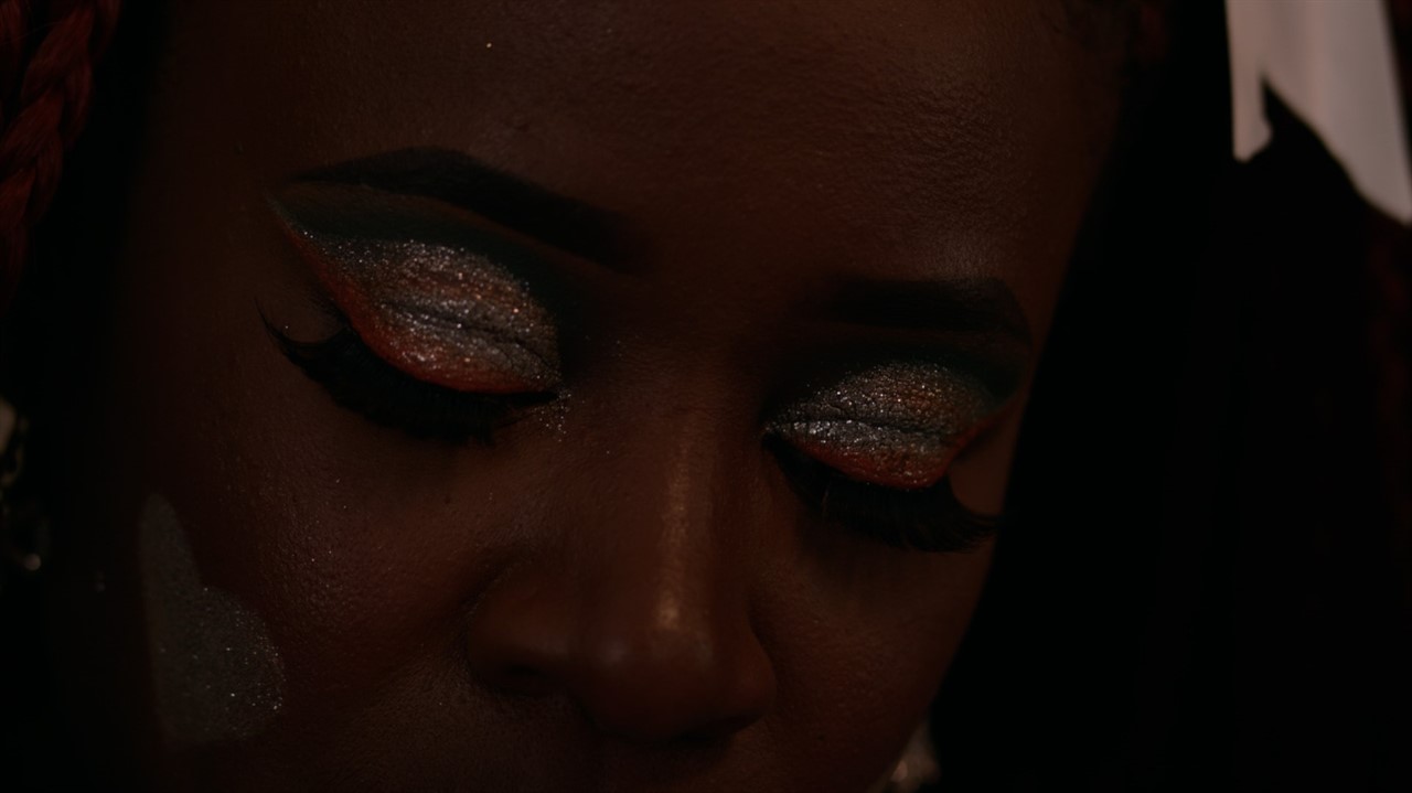 Closeup of Black woman with sparkly eyeshadow